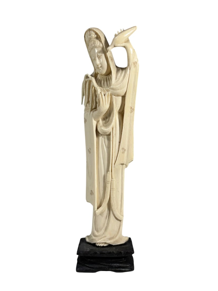 Carved Asian Lady Figure Sculpture on Wood Stand: Carved figure sculpture depicting a robed standing lady holding a fan, with a bird perched behind her shoulder. Mounted on a carved wood display stand. No visible maker's marks or country of origin we