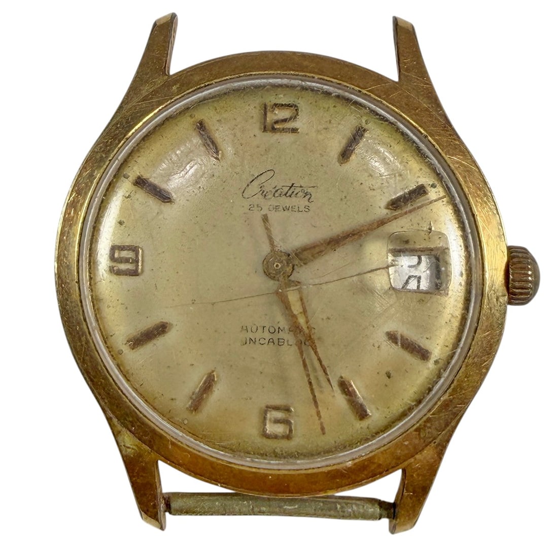 Creation Swiss Automatic 25J Date Wristwatch Gold: Vintage Creation Swiss automatic wristwatch featuring a gold-tone case, silver-tone dial, applied Arabic numerals and baton hour markers, center seconds, and a date window at the 3 o'clock position. D