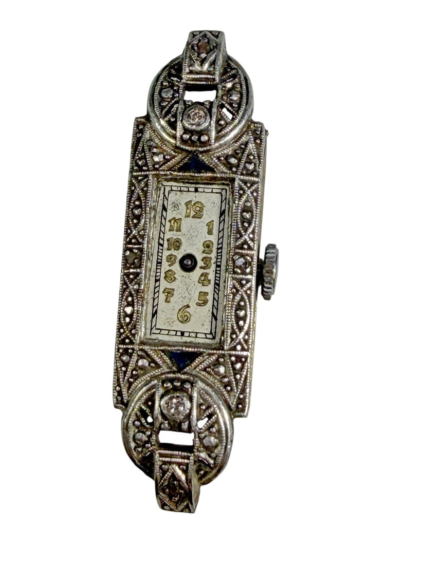 Art Deco 18K Gold Ladies Wristwatch Case: Art Deco ladies wristwatch with an 18K yellow gold case and an ornate white metal front accented with marcasites and blue enamel details. Features a rectangular dial with Arabic numerals. The reverse 