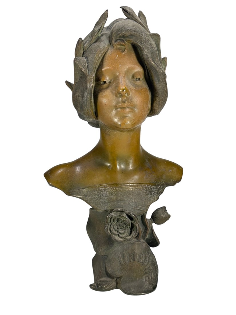 Art Nouveau Style Metal Bust 'Undine' Sculpture: Art Nouveau style metal bust sculpture depicting a young woman with flowing hair adorned with leaves and floral motifs. The base is cast with the name "UNDINE," likely identifying the subject rather t