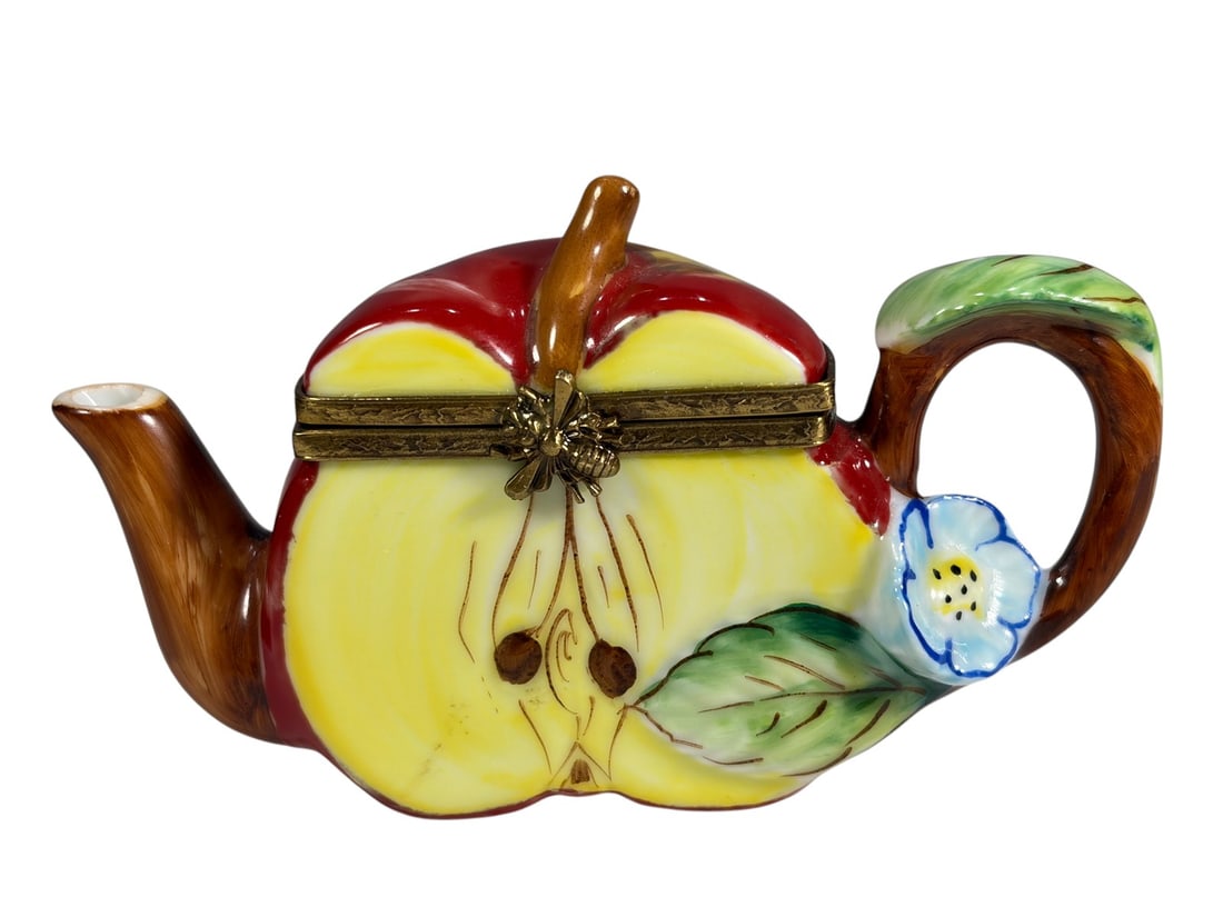 Limoges Apple Teapot Trinket Box Peint Main France: Hand-painted Limoges France porcelain hinged trinket box in the form of an apple teapot with branch-form spout and handle, leaf-form handle top, and gilt-tone metal mounts. The interior features a han