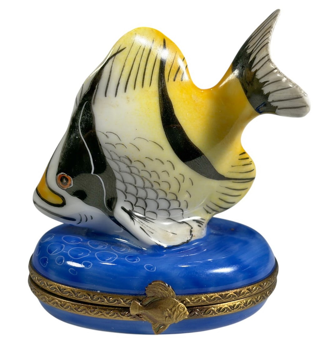 Limoges Tropical Fish Trinket Box Peint Main Rare: Hand-painted Limoges porcelain trinket box modeled as a tropical fish swimming over a blue ocean base with gilt metal mounts and clasp. Interior decorated with a hand-painted starfish. Marked Peint Ma