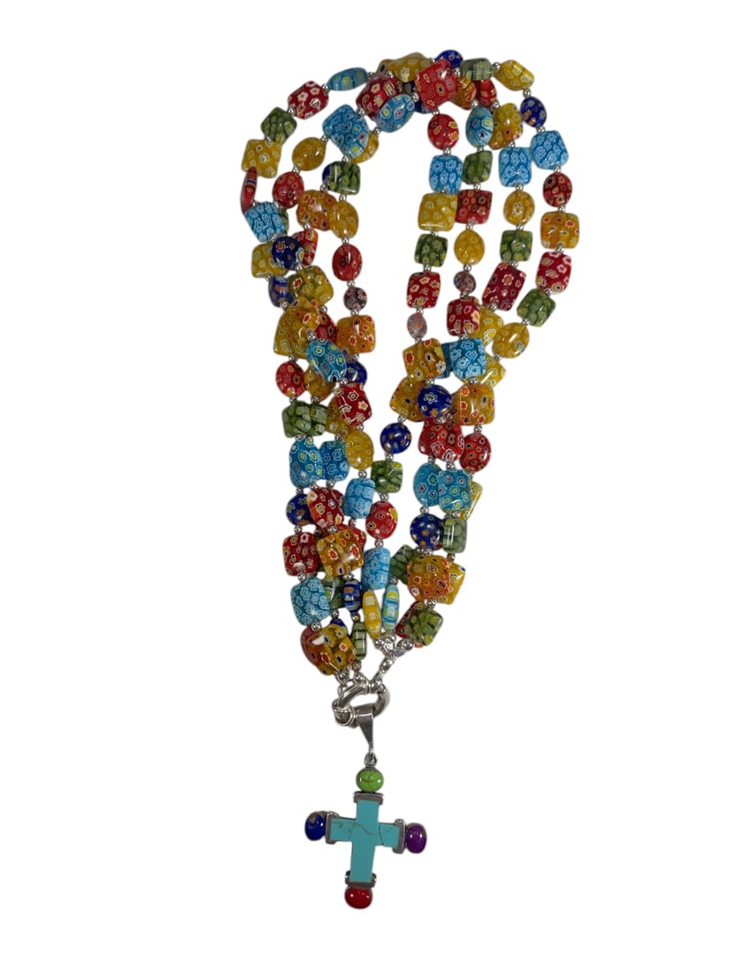 Sterling Silver Millefiori Turquoise Necklace: Multi-strand necklace composed of colorful millefiori glass beads in red, blue, yellow, green, orange, and white tones, accented with silver-tone spacer beads. Centered by a turquoise-inlaid cross pen