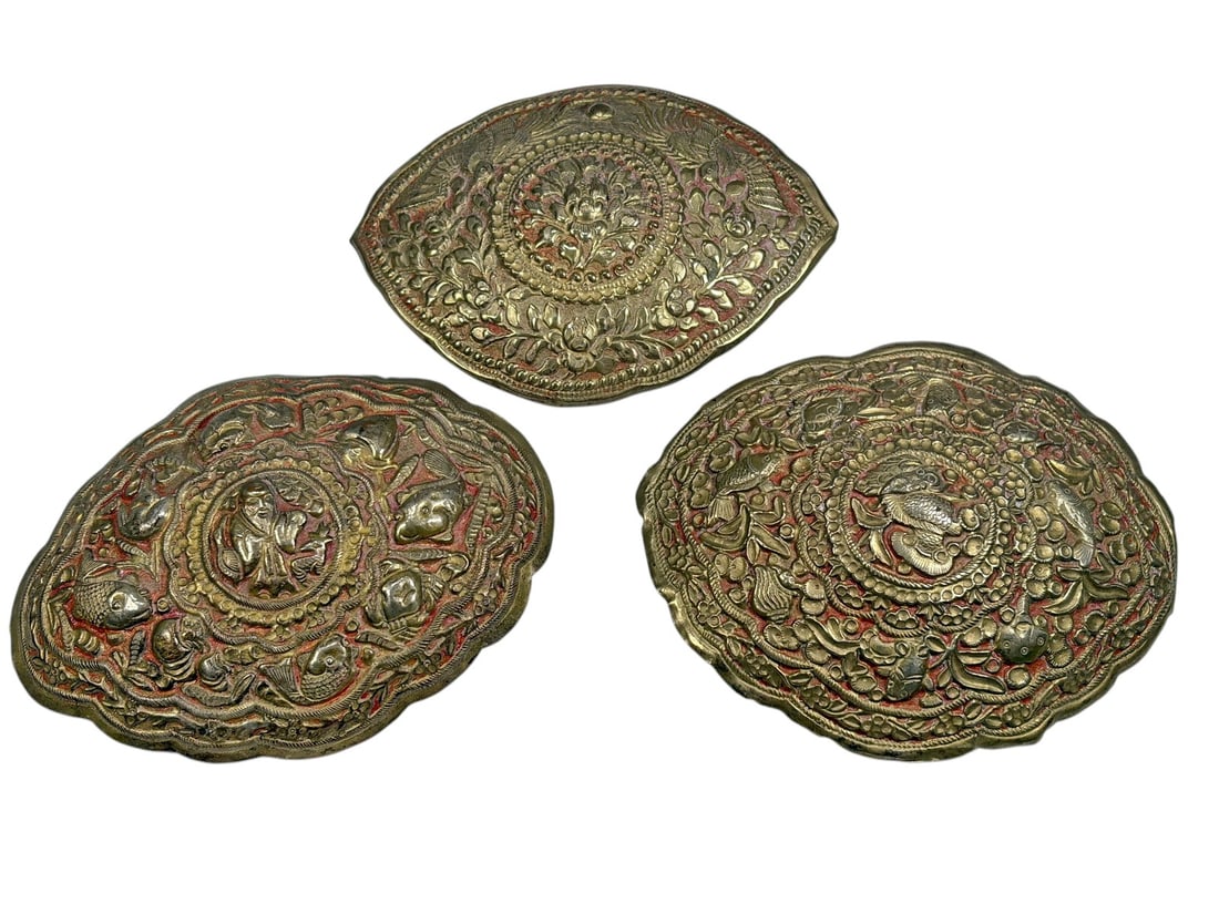 Figural Low-Grade Silver Repousse Buckles 3pc LOT: A set of three decorative low-grade silver buckles featuring elaborate repousse and chased decoration with floral, foliate, bird, and fish motifs. Each buckle is individually shaped and centered with 