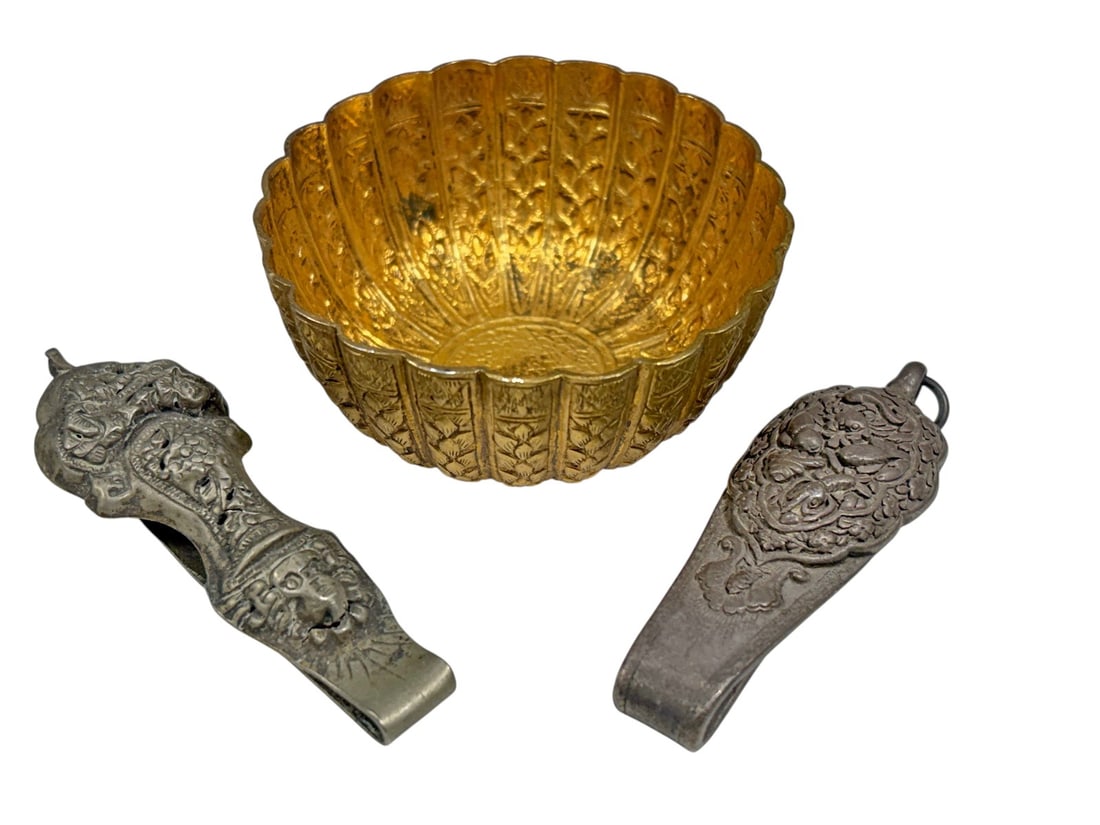 Chinese Silver Accessories & Metal Bowl 3pc LOT: Group of three Chinese decorative objects comprising two silver hanging accessories richly decorated with repousse floral, figural, and auspicious motifs, together with a small gilt-metal lobed bowl w
