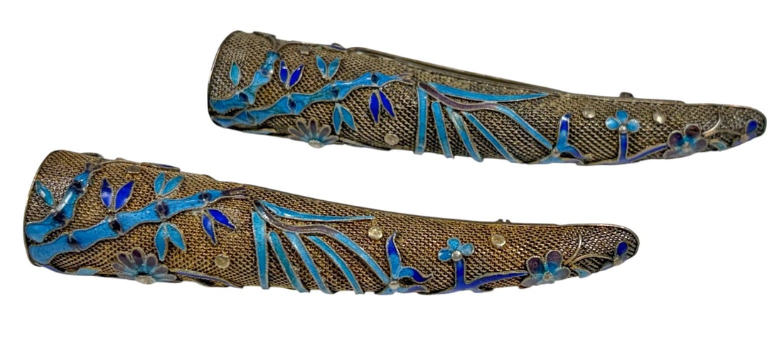 Chinese Filigree Silver Enamel Nail Guards 2pc LOT: Pair of Chinese silver fingernail guards with finely worked filigree surfaces, decorated with blue and turquoise enamel floral and foliate motifs with small applied accents. Each has a long curved tap