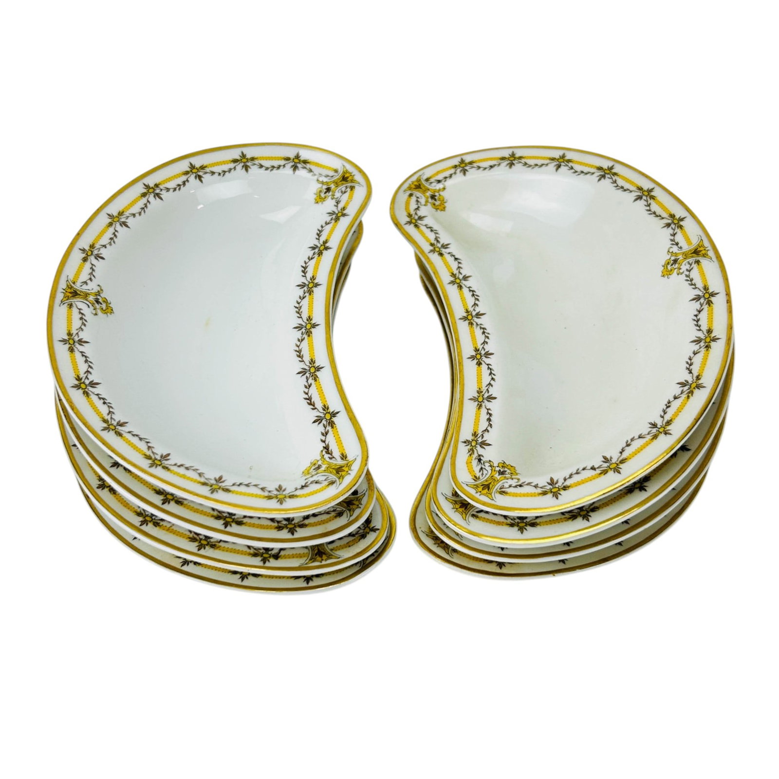 Haviland Limoges Porcelain Crescent Bone Dish LOT: Haviland & Co. Limoges France porcelain table ware crescent shaped bone dishes, set of eight. The white bodies feature gilt rims with yellow and brown foliate garland borders and repeating scroll moti