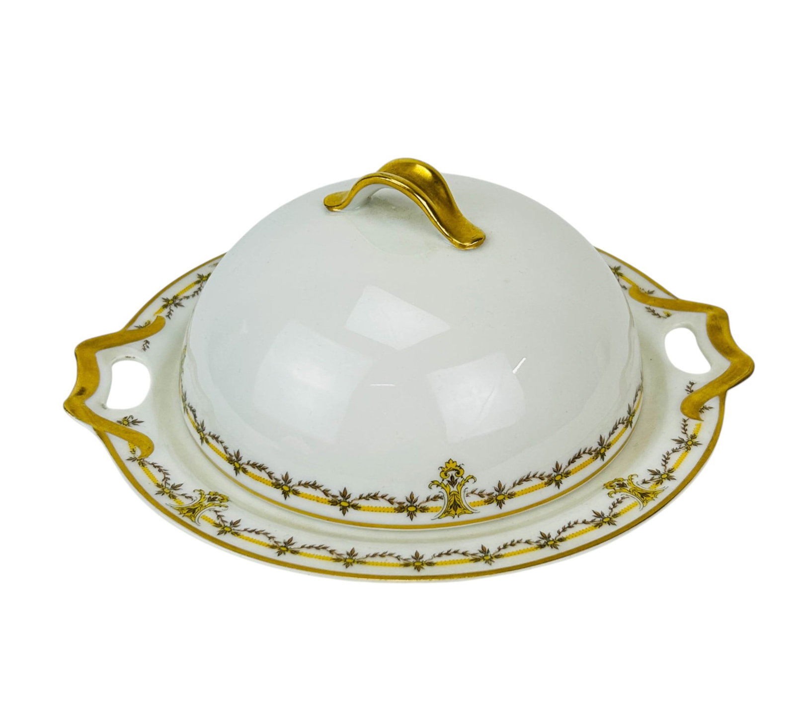 Haviland Limoges Covered Butter Dish w/ Strainer: Haviland & Co. Limoges France porcelain table ware covered butter dish with strainer. The white glazed body decorated with gilt and brown floral borders. Oval form with integrated open handles, remova