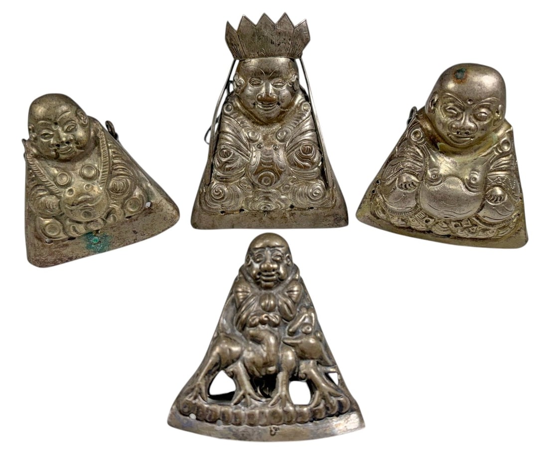 Chinese Low-Grade Silver Figural Ornaments 4pc LOT: Set of four Chinese low-grade silver figural ornaments, each modeled as a seated smiling monk or auspicious figure with detailed robes and individualized attributes. One figure wears a tall crown-like