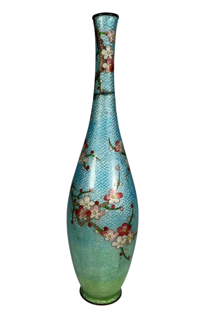 Japanese Meiji Ginbari Cloisonne Enamel Vase 12": Japanese Meiji-period ginbari cloisonne enamel vase featuring a slender elongated neck and rounded body. Decorated with flowering branches in pink, white, red, and green enamels over a shimmering
