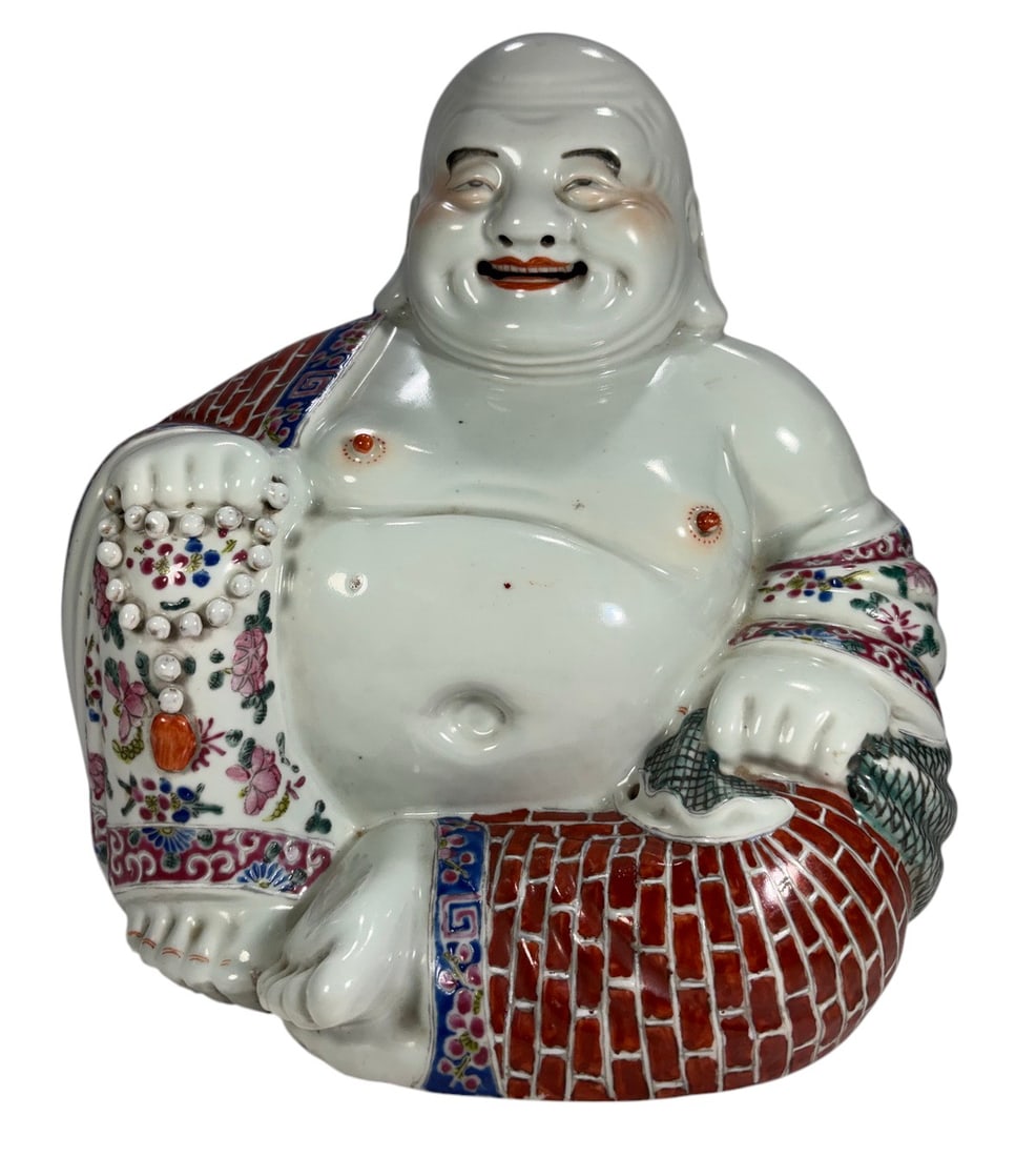 Chinese Famille Rose Porcelain Budai Figure 10": Chinese porcelain figure of Budai, the Laughing Buddha, modeled seated with exposed belly, prayer beads, and a sack, and decorated in colorful famille rose enamels. The underside bears an oval impress