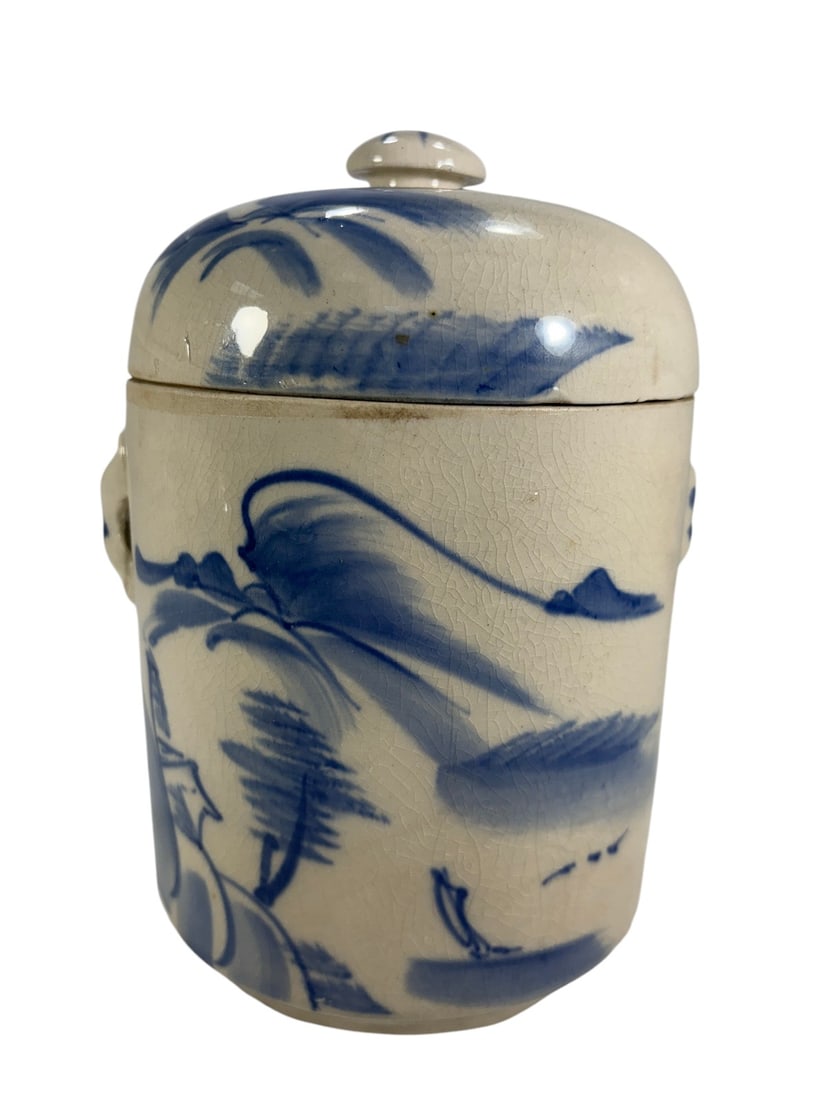 Late QingEarly Republic Chinese Crackleware Jar: Chinese blue-and-white crackle-glaze covered jar, dating to the late Qing to early Republic period, circa 18901920. Of cylindrical form with a domed lid and rounded knop finial, the vessel is