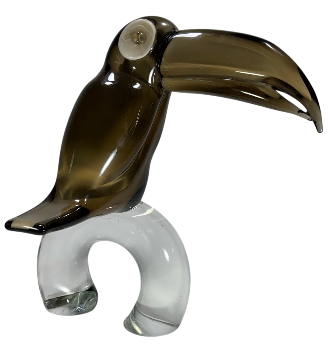 Italian Zanetti Murano Glass Toucan Sculpture: Large Italian Murano art glass toucan sculpture attributed to Licio Zanetti, modeled with a dramatically oversized curved beak, smoky brown head and body, contrasting white glass eye, and a thick clea