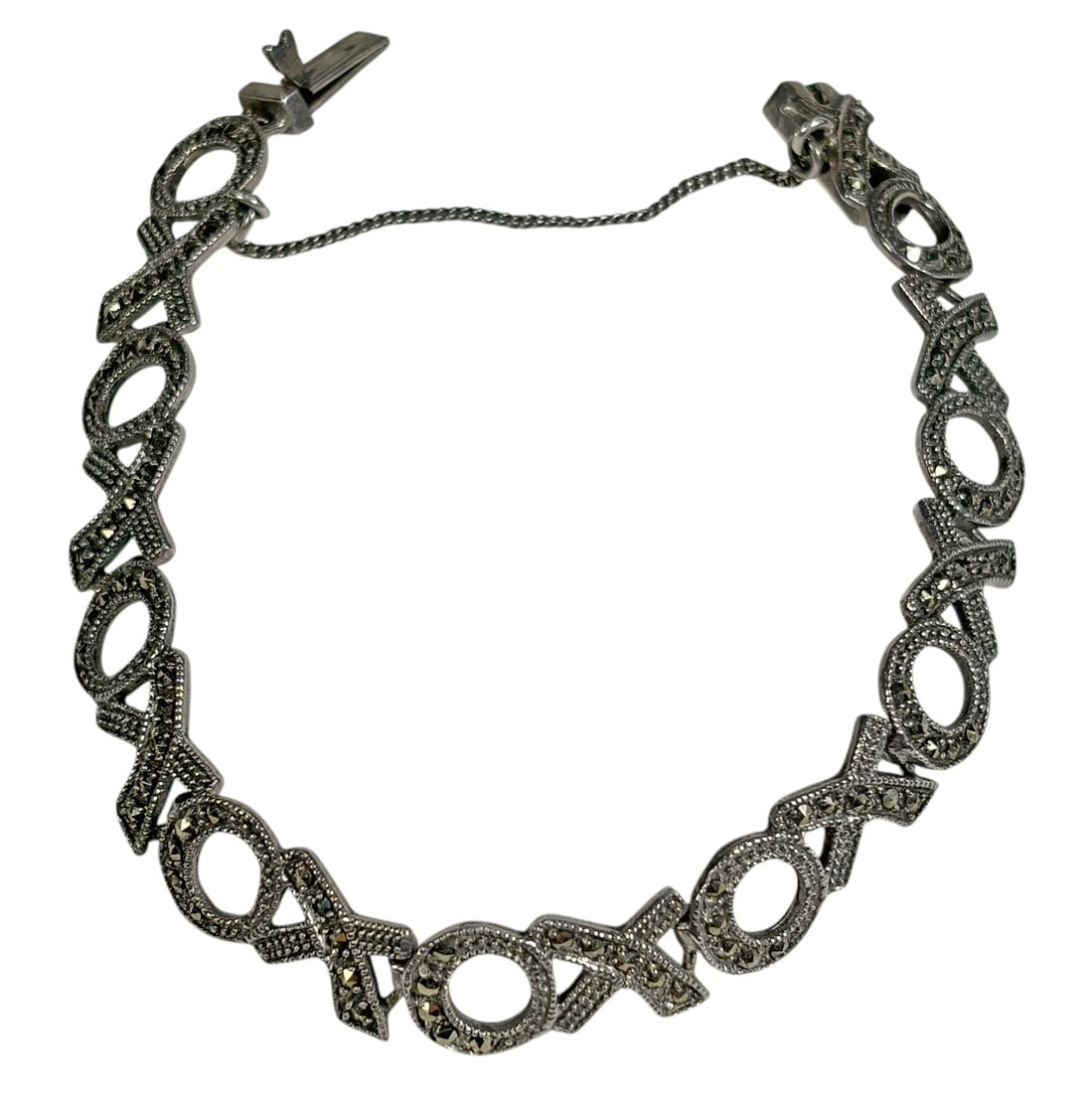 Sterling Silver Marcasite XOXO Bracelet 17 grams: Sterling silver bracelet featuring an alternating X and O openwork link design accented with marcasite-style stones. The bracelet measures approximately 8 inches long and weighs approximately 17 grams