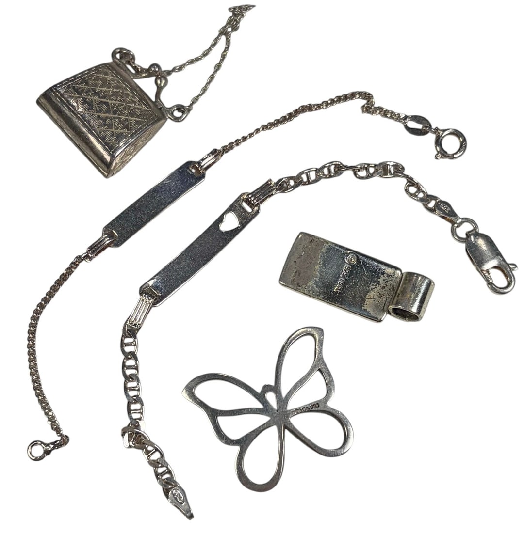 Assorted Tiffany Sterling Silver & Others 5pc LOT: Assorted group of 5 sterling silver jewelry and accessory pieces, including two chain bracelets with rectangular ID-style plaques, an openwork butterfly-form piece, a Celtic knot-design pendant or cha