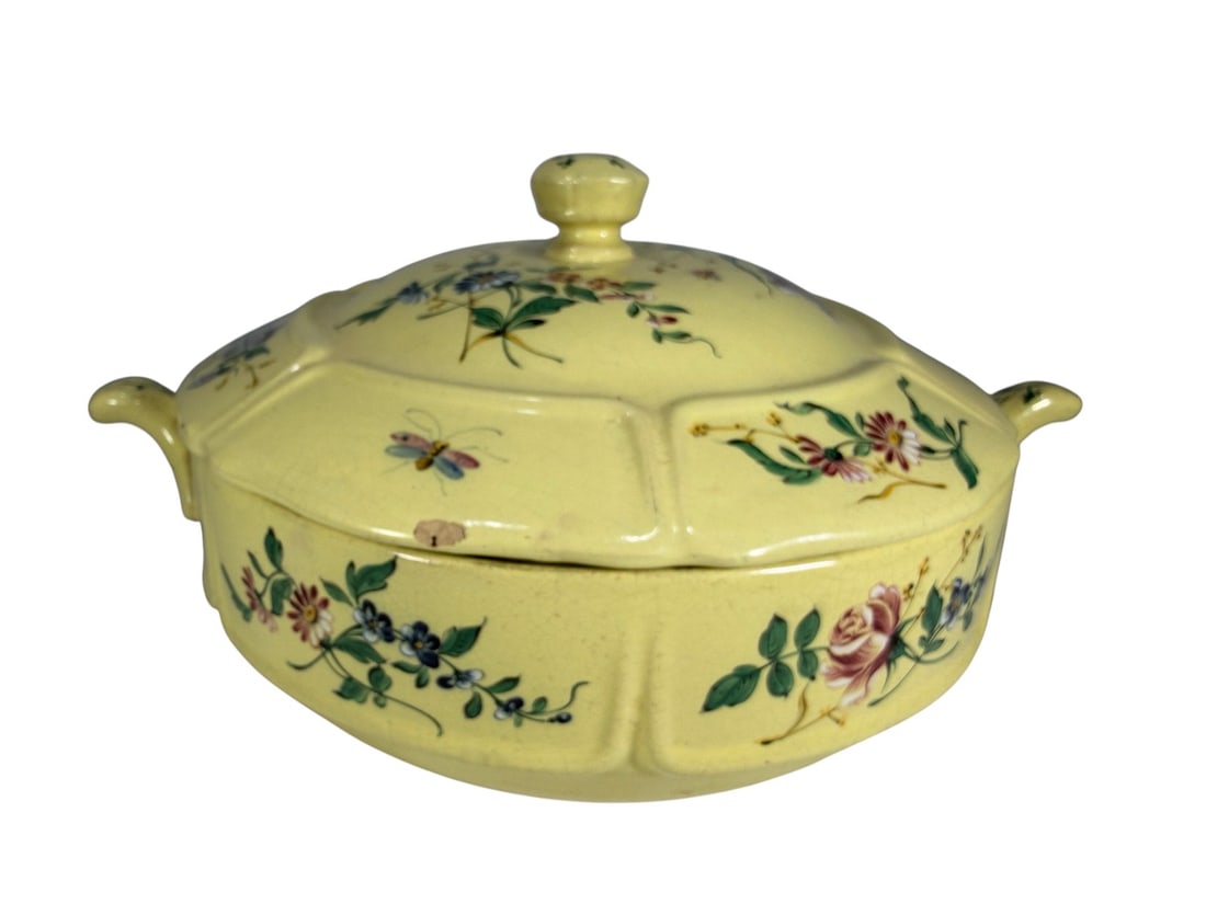 Henri Delcourt French Floral Covered Tureen: French faience covered tureen by Henri Delcourt, of low circular lobed form with twin side handles and a fitted domed cover surmounted by a faceted knop. The pale yellow-glazed ground is hand-painted 