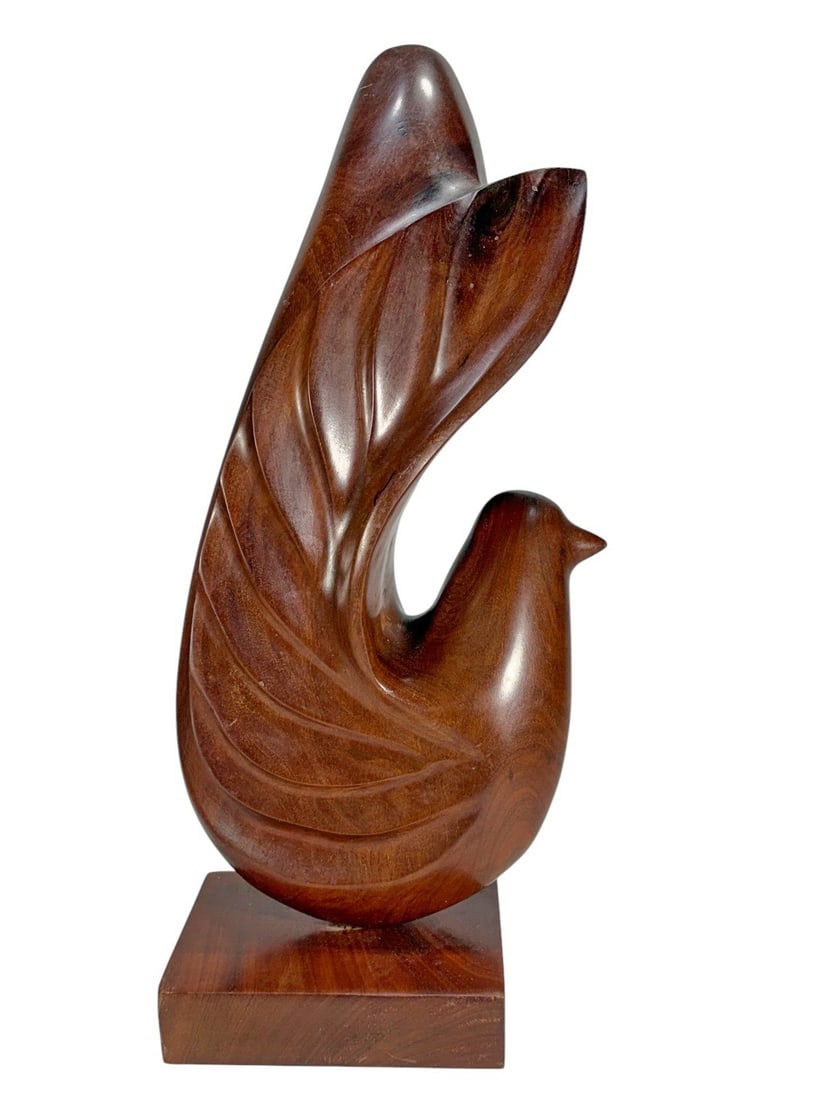 Modern Scandinavian Carved Wood Bird Sculpture: Modern Scandinavian-style carved wood sculpture of an abstract bird with sweeping wing form, mounted on an integral base. Dimensions: 17.75 X 7 X 4.5 in. Condition: Good overall condition having no