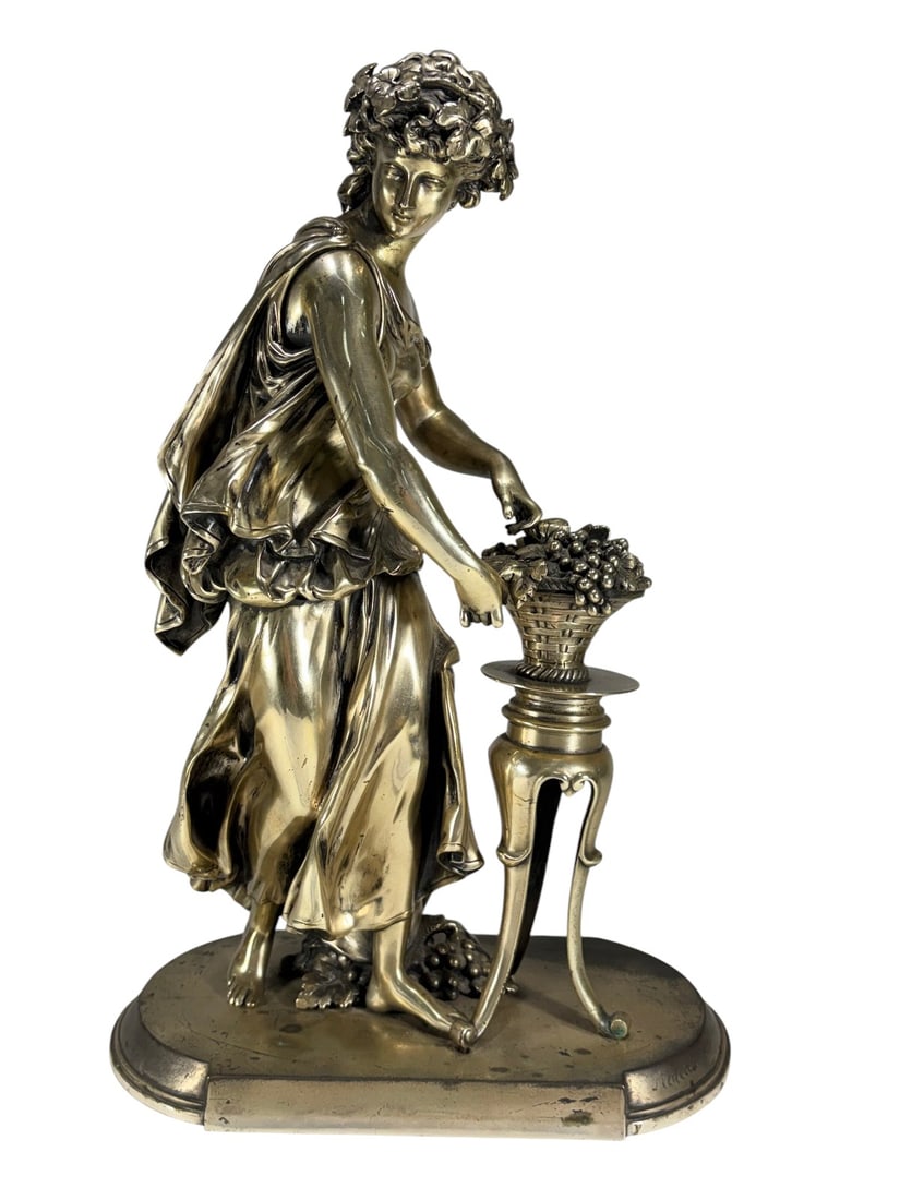 Mathurin Moreau Maiden & Grapes Bronze Sculpture: Silver-plated bronze figure titled 'Maiden & Grapes' by Mathurin Moreau (French, 1822 - 1912), depicting a draped woman beside a grape-filled pedestal, in Moreau's romantic neoclassical style. Signed 