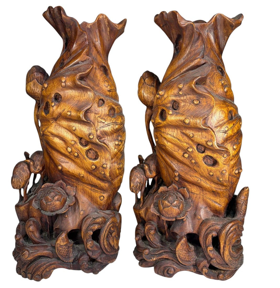 Chinese Carved Lotus Wood Decorative Vases 2pc LOT: Two pieces lot of Chinese carved wood decorative vases, each modeled with large lotus-leaf forms and flaring blossom-form rims. Deeply carved throughout with lotus buds, blossoms, foliage, pierced