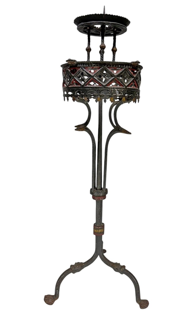 Antique Gothic Wrought Iron Tripod Pedestal Stand: Antique Gothic-style wrought iron pedestal stand featuring an openwork circular basket with geometric tracery and remnants of red-painted decoration. The tall architectural form is supported by three