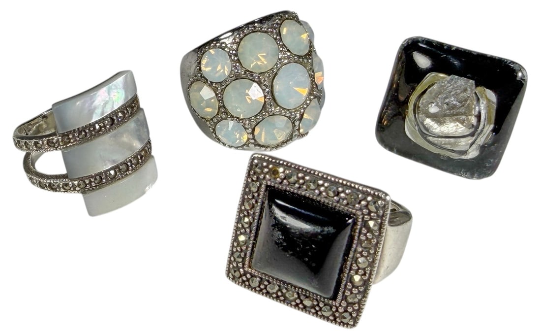 Assorted Sterling Silver Gemstone Rings 4pc LOT: A group of four decorative silver rings featuring assorted statement designs. The lot includes a wide ring set with multiple luminous white cabochons, a modern ring with three horizontal iridescent