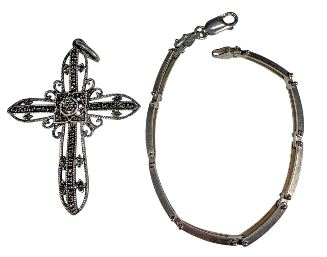 925 Silver Marcasite Cross & Bracelet 2pc LOT: A two-piece sterling silver lot consisting of an ornate cross pendant and an articulated bracelet. The cross features intricate openwork decoration with numerous marcasite-style accents and scroll det