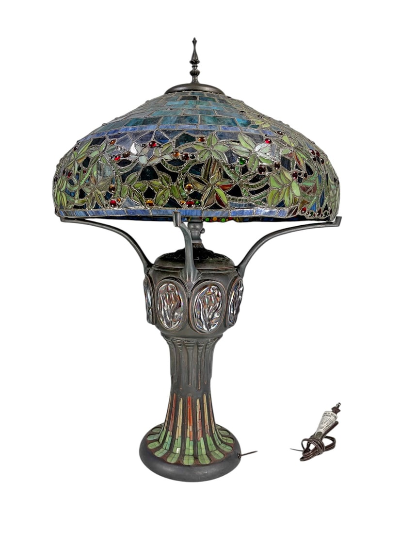 Gracewood Hollow Rezzoug Stained Glass Table Lamp: Gracewood Hollow Rezzoug multicolored stained glass table lamp featuring a broad domed shade composed of blue, green, and iridescent glass panels with trailing leafy motifs and applied colored glass a