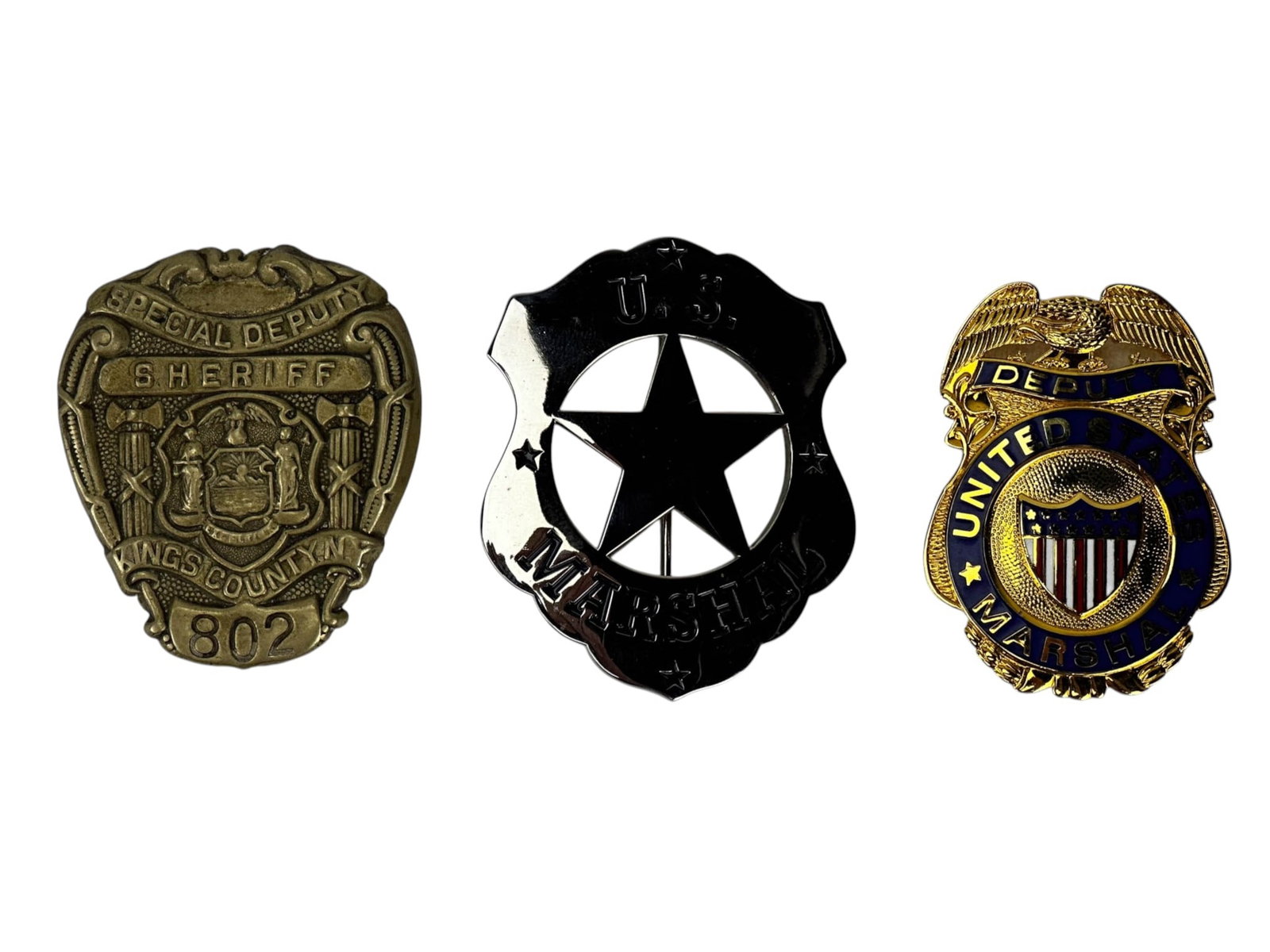 US Marshal & Kings County Special Deputy Badge LOT: Lot of three law enforcement badges comprising a U.S. Marshal shield form badge with pierced central star, marked on reverse with name, Commemorative 1923-2011 and accompanied by a fitted presentation