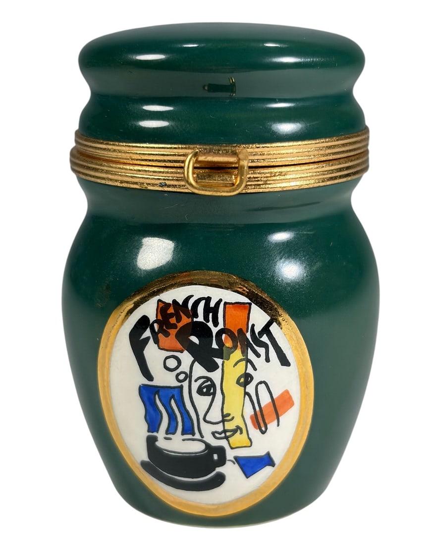 Limoges France Porcelain Roast Coffee Trinket Box: Hand-painted Limoges France porcelain hinged trinket box modeled as a dark green coffee canister, decorated with a colorful cafe-style graphic and gilt trim. The box opens at the center and includes a