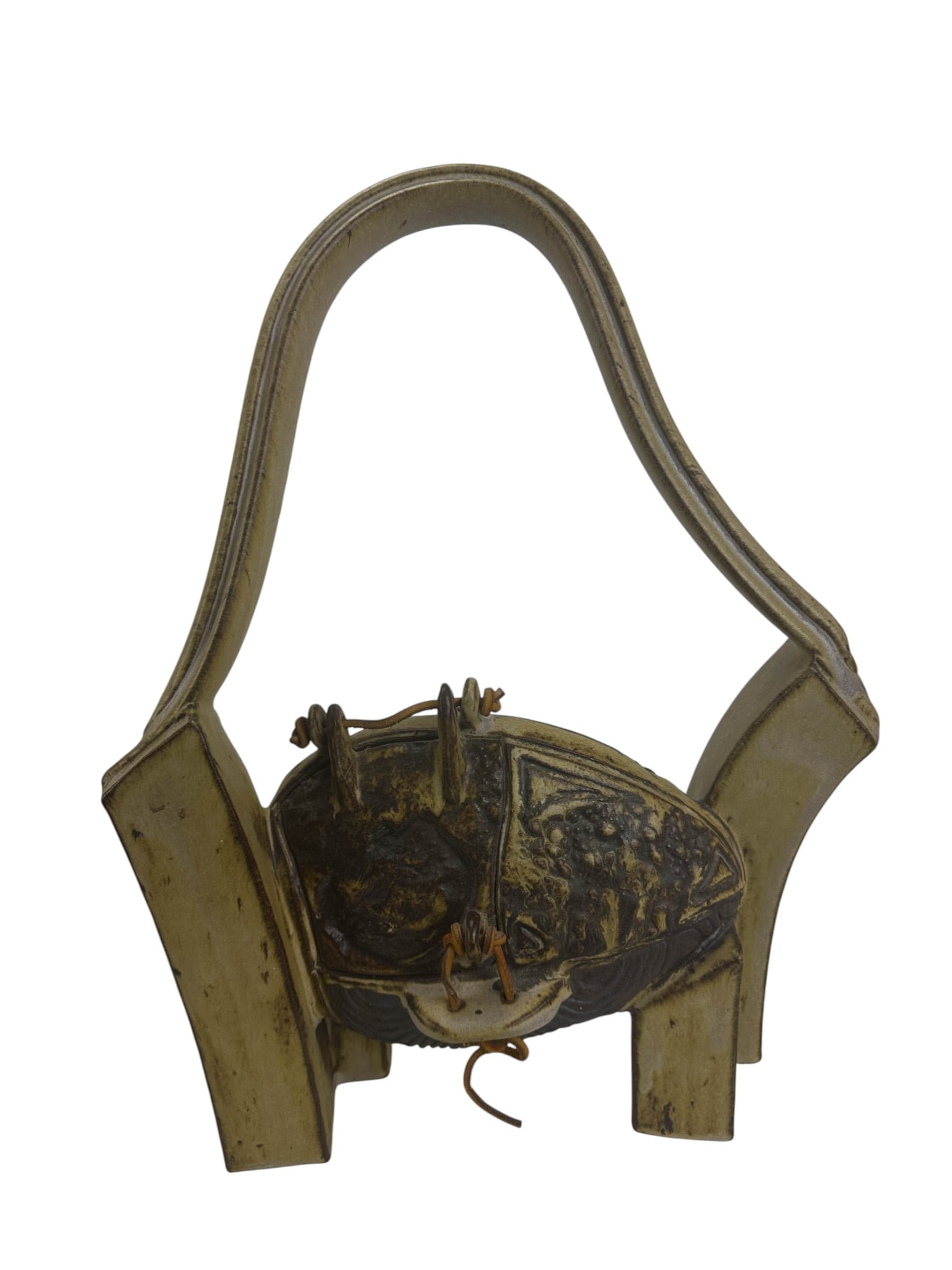 Mid Century Studio Art Pottery Abstract Sculpture: Mid-century modern studio stoneware salt glazed pottery sculptural modeled as a handbag or basket, featuring a tall arched handle supported by four architectural feet. The central rounded body is comp