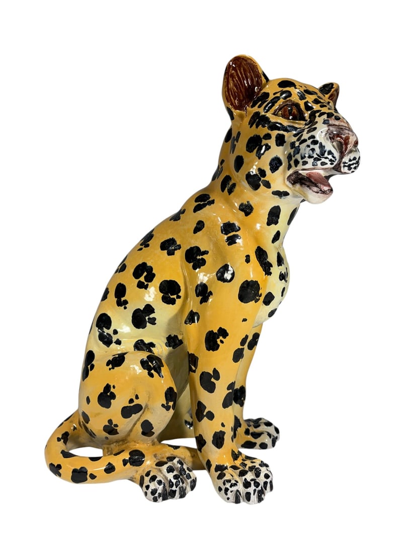 Vintage Italian Pottery MCM Leopard Sculpture 19": Italian hand-painted pottery leopard sculpture with a seated pose and glossy glazed finish. Marked on the underside "Made for Elaya, I. Reiselman Imports." Suitable as a decorative accent. Dimensions: