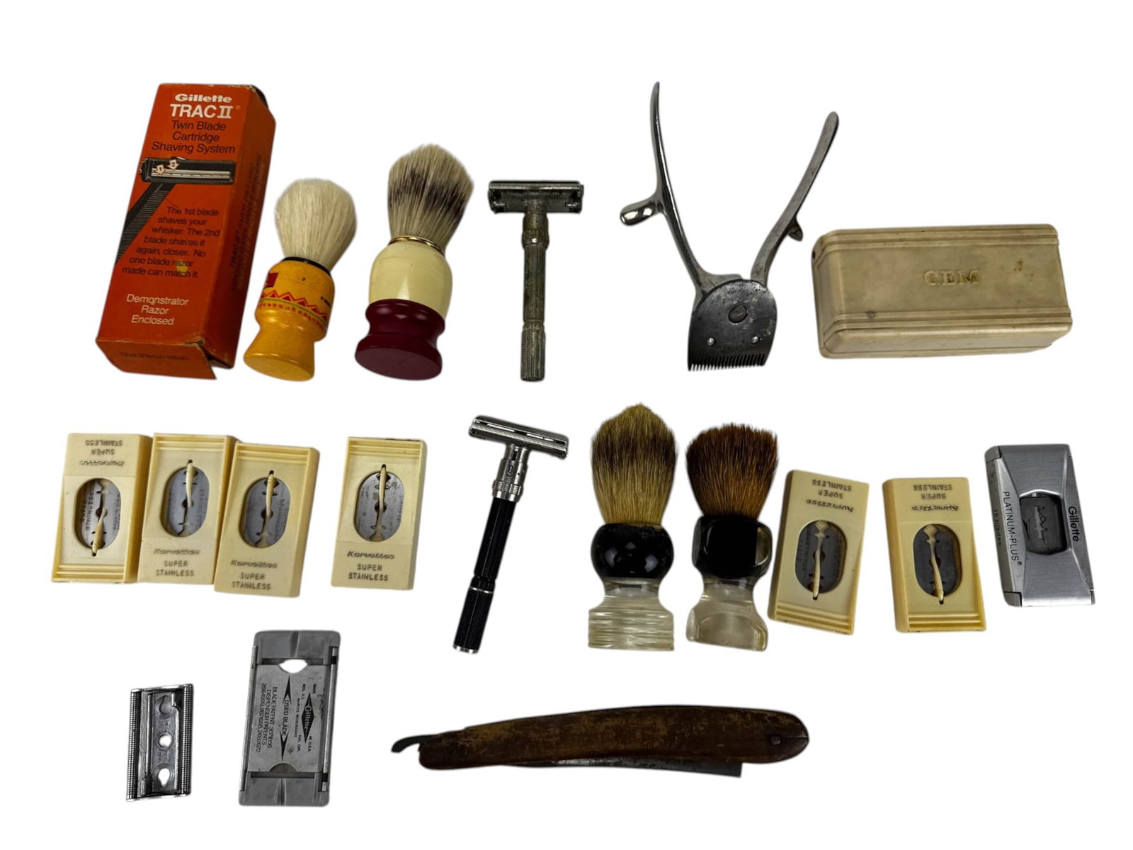 Safety Razors Shaving Brushes Blades & Strop LOT: Assorted vintage mens shaving and grooming collection comprising multiple double-edge safety razors, a mechanical hand-operated hair clipper, shaving brushes with assorted molded and clear handles,
