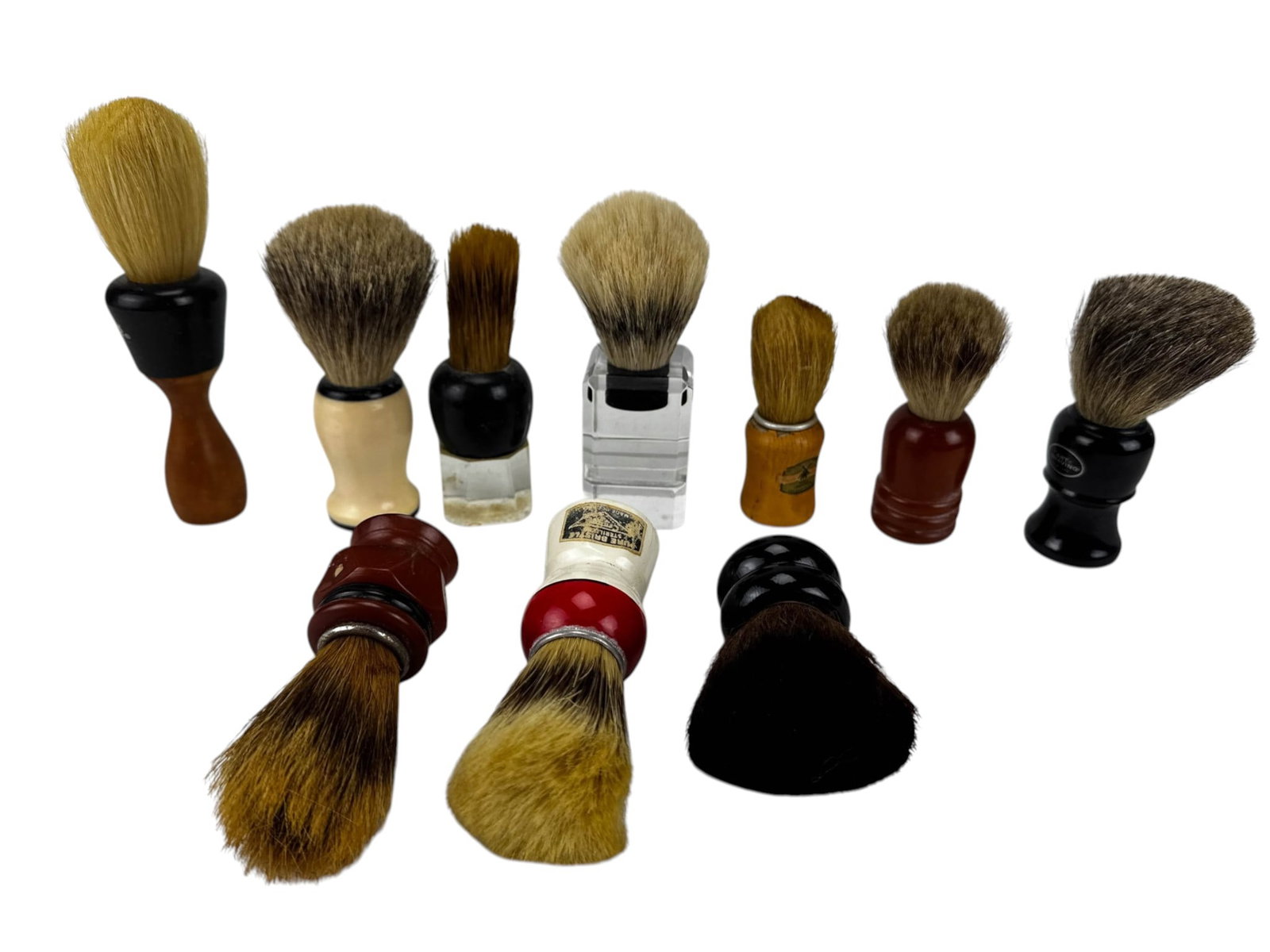 Bakelite Wood Lucite Barber Shop Shaving Brushes: Estate collection of ten shaving brushes with assorted molded, bakelite, wood, acrylic, and resin handles. Includes examples marked The Art of Shaving, Barber Shop Pure Bristle, and Peerless Pure
