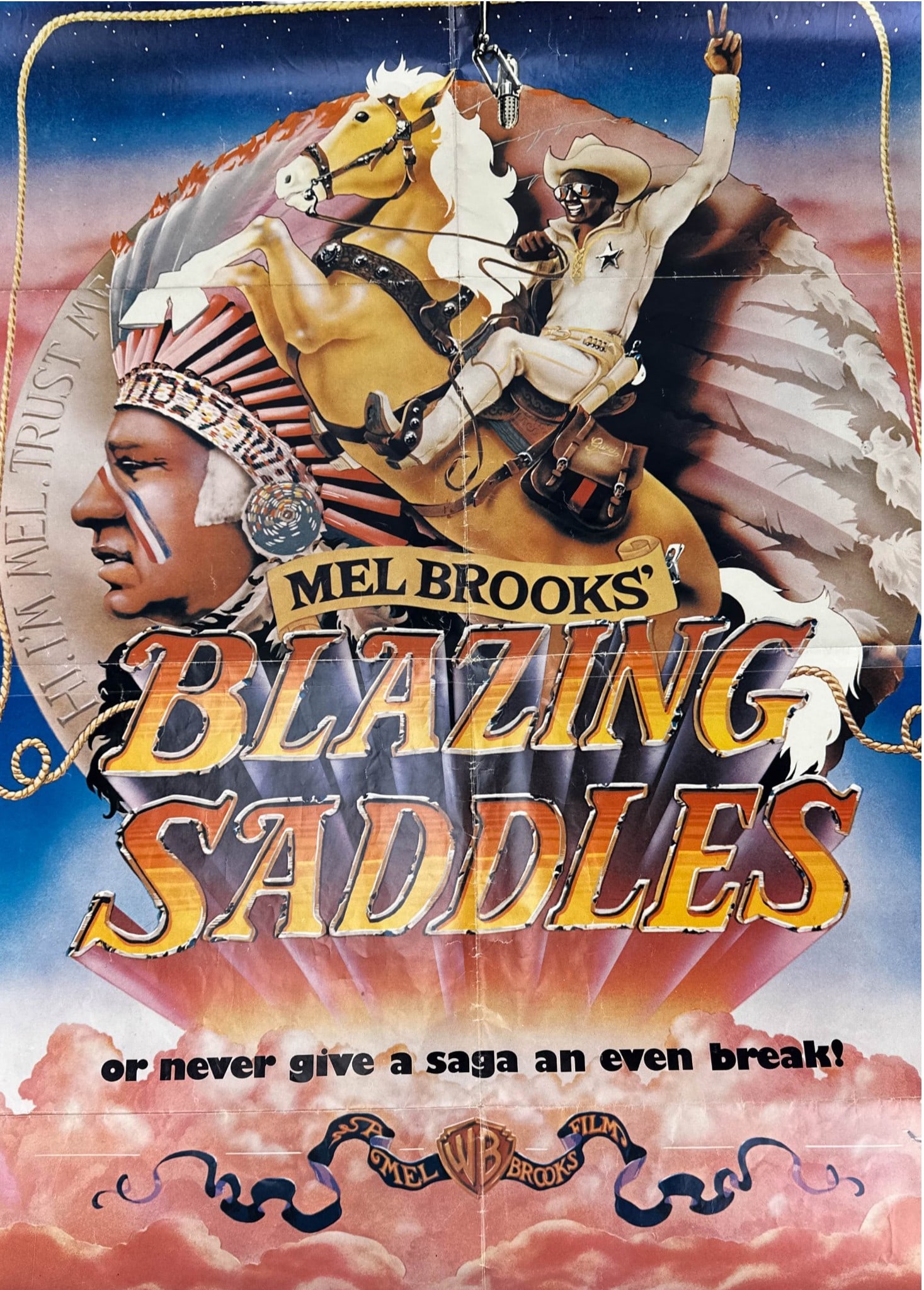 Mel Brooks Blazing Saddles 1974 One Sheet Poster: Original-style theatrical one sheet poster for Mel Brooks 1974 Warner Bros. comedy Blazing Saddles, featuring illustrated artwork with Cleavon Little on horseback and a Native American profile, the