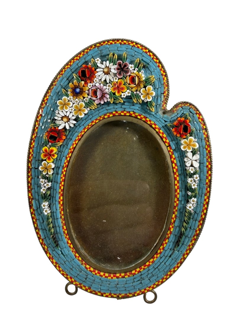 Victorian Edwardian Micromosaic Picture Frame: Antique Victorian to Edwardian gilt metal picture frame of artist's palette form, decorated with colorful floral micromosaic work. Features an oval opening, multicolored glass tesserae, and a folding 