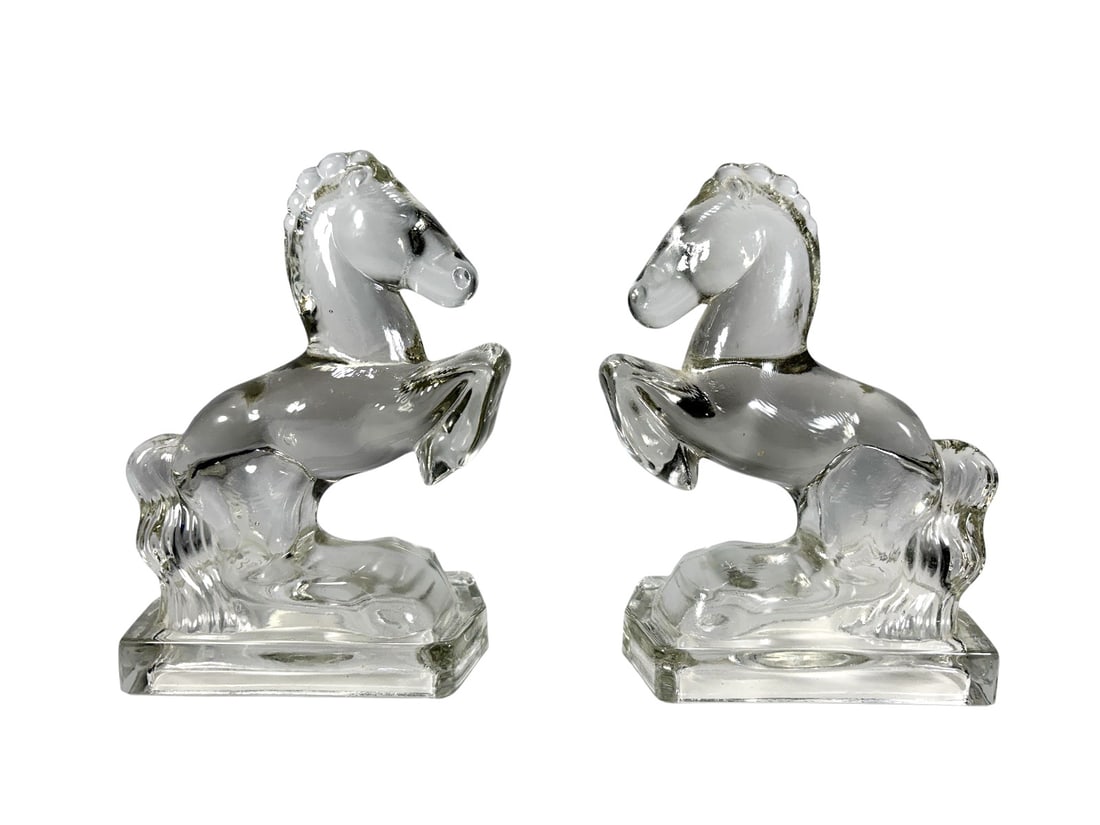 Pressed Glass Rearing Horse Bookends 2pc LOT: Two pressed glass bookends, each modeled as a rearing horse on a rectangular base. Clear glass construction with molded details throughout. No apparent maker's marks. Each measures approximately 8 x