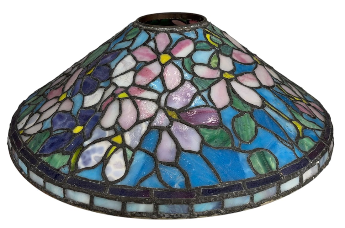 Tiffany Style Floral Stained Glass Lamp Shade: Tiffany style domed stained glass lamp shade decorated with an all-over floral and foliate pattern in shades of pink, lavender, white, green, yellow, and blue. Constructed with individually fitted pie