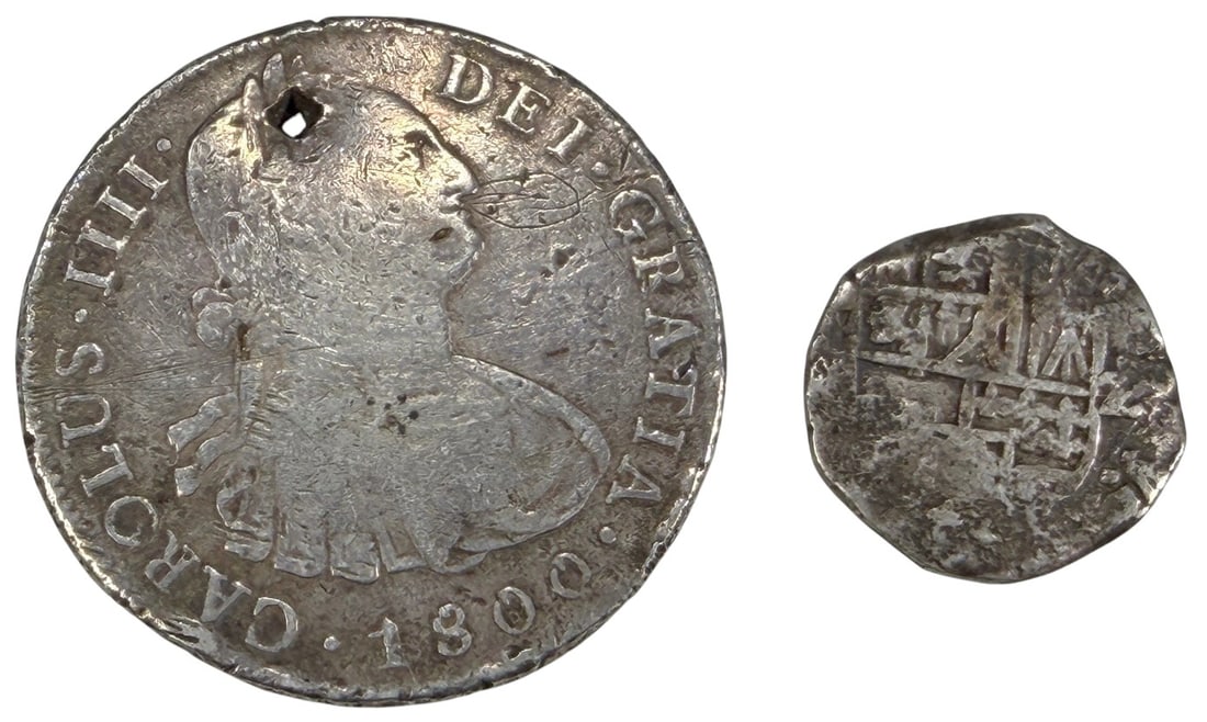 17th-18th C Spanish Colonial Silver Coins 2pc LOT: Lot of two Spanish Colonial silver coins dating from the 17th and 18th centuries. Includes one larger coin depicting the bust of King Charles IV dated 1800 with a suspension hole near the rim, and one