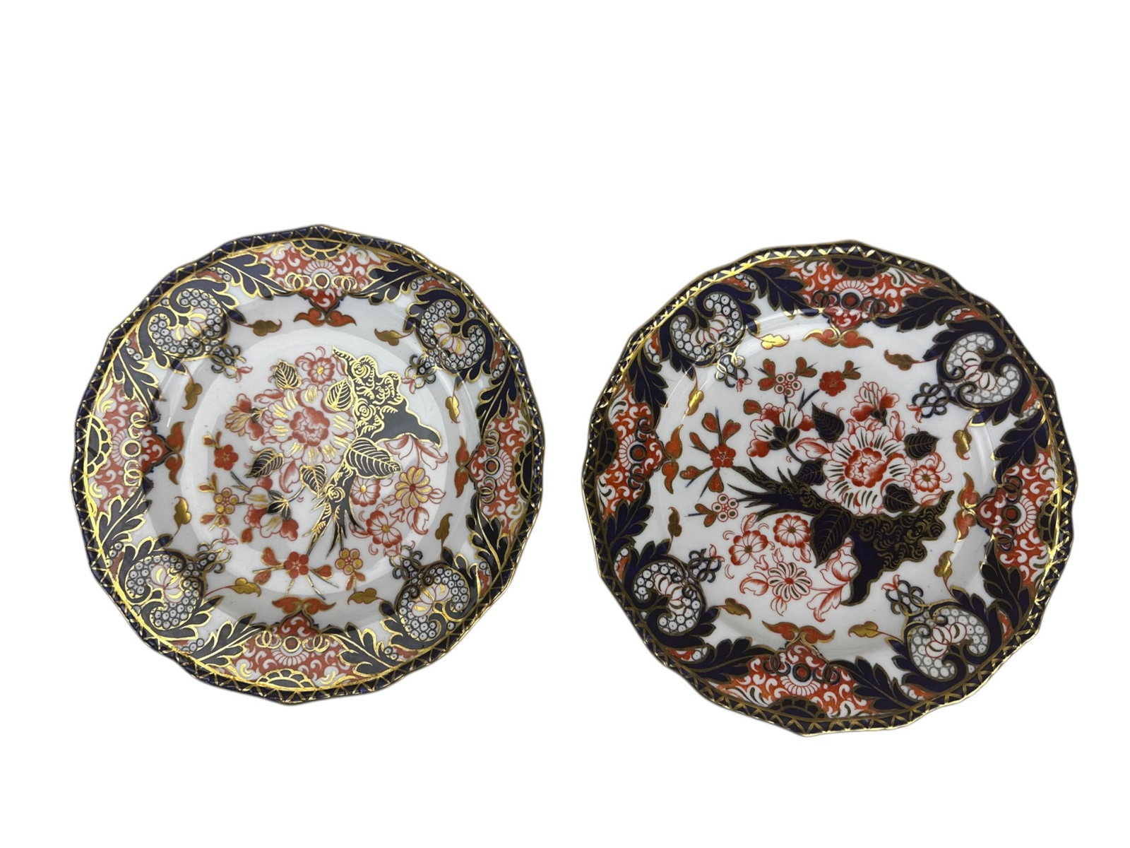 Royal Crown Derby Porcelain Kings Luncheon Plates: Pair of late 19th century English porcelain plates by Royal Crown Derby, modeled in the Kings pattern. Decorated in the traditional Imari palette with floral and foliate motifs in iron red, deep cobal