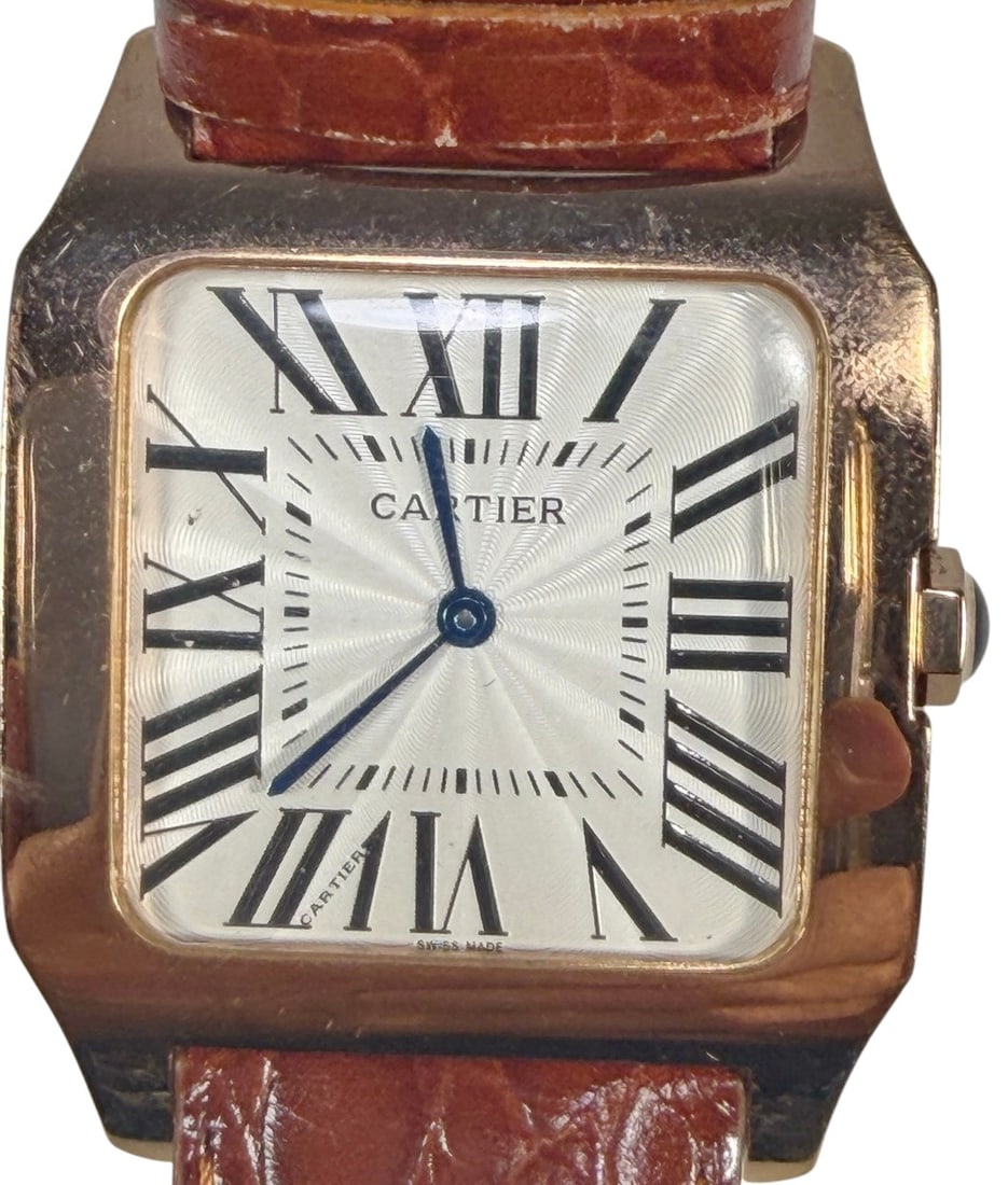 Inspired Famous Design Gold-Tone Quartz Watch: Gold-tone quartz wristwatch in the Cartier style, featuring a rectangular case with rounded corners, white dial with oversized black Roman numerals, blue-tone hands, and a brown embossed leather