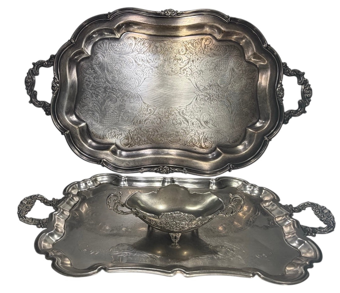 Silver-Tone Metal Engraved Serving Ware 3pc LOT: Three-piece lot of silver-tone metal serving ware comprising two handled rectangular trays with shaped borders and engraved foliate decoration, together with a handled serving bowl or dish with raised