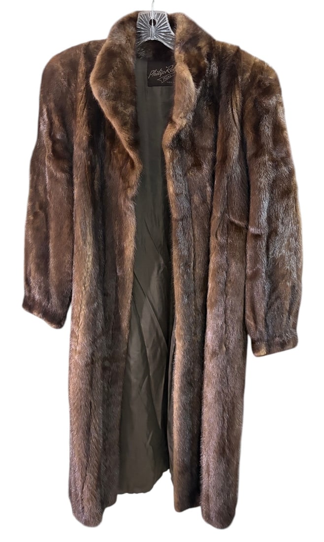 Vintage Philip Reiner New York Vintage Fur Coat ML: Vintage full-length brown fur coat by Philip Reiner Furs, New York. Designed with a high collar, long sleeves, vertical fur construction, and a fully lined interior. Interior label reads Philip Reiner