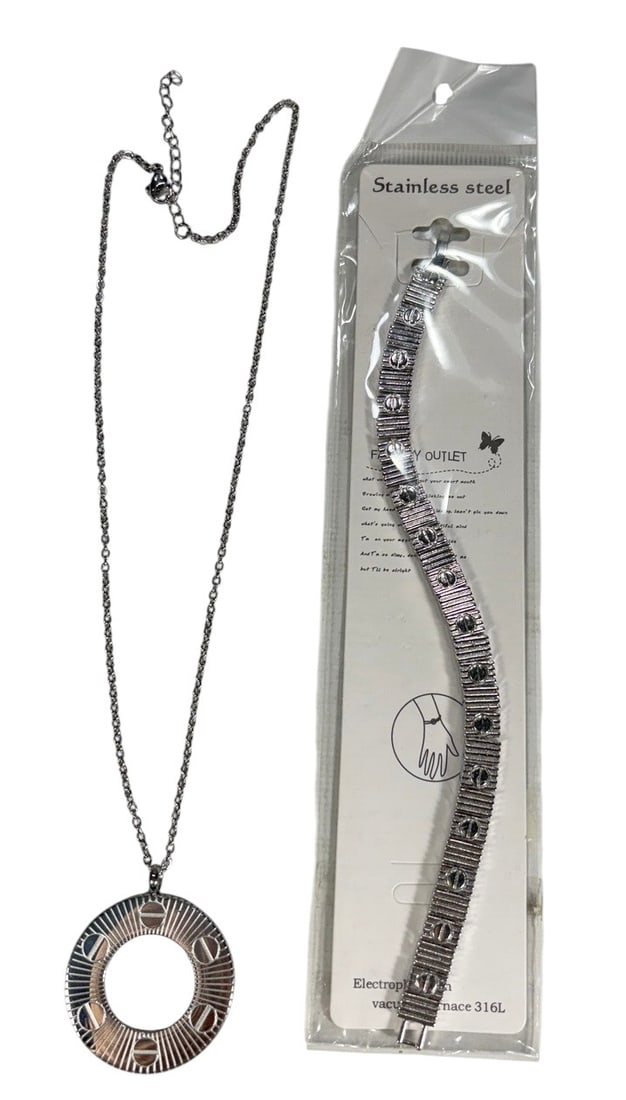Silver-Tone Love Inspired Jewelry 2pc LOT: Two-piece silver-tone stainless steel fashion jewelry lot inspired by the iconic Cartier Love design, including a circular pendant necklace and matching-style bracelet decorated with screw motifs. The