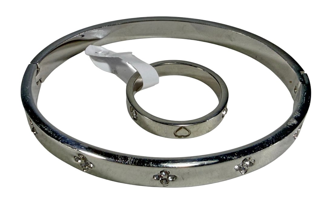 Designer Inspired Silver-Tone Jewelry 2pc LOT: Two-piece silver-tone fashion jewelry lot including a bracelet and a separate size 10 ring, both featuring designs inspired by well-known luxury designer styles and produced by other manufacturers. Th