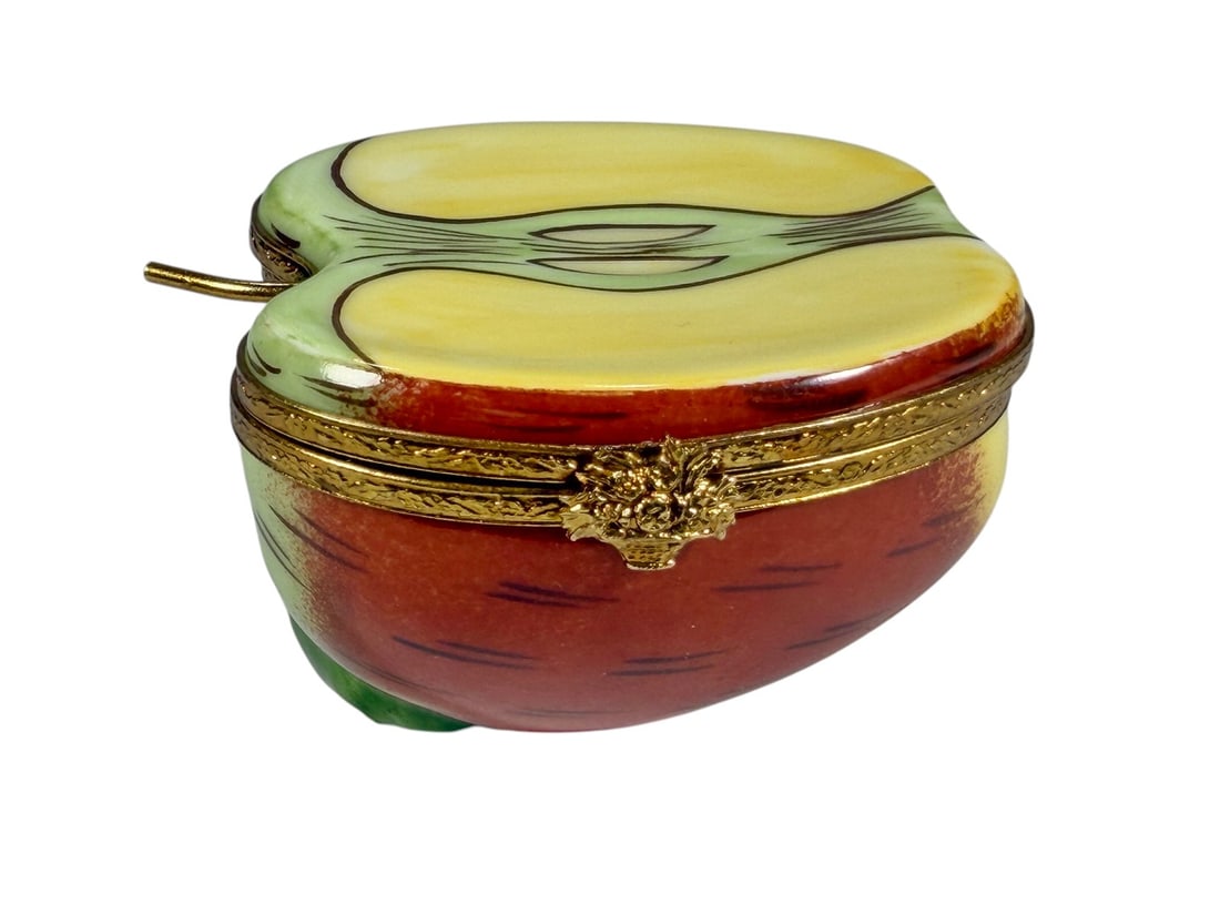 Limoges France Apple Porcelain Trinket Box: https://chatgpt.com/c/6a9df425-7800-83ea-a663-0208beae2e6f#:~:text=Description%3A-,Hand%2Dpainted%20Limoges%20France%20porcelain%20trinket%20box%20modeled%20as%20a%20stylized%20apple%2C%20decorated%20