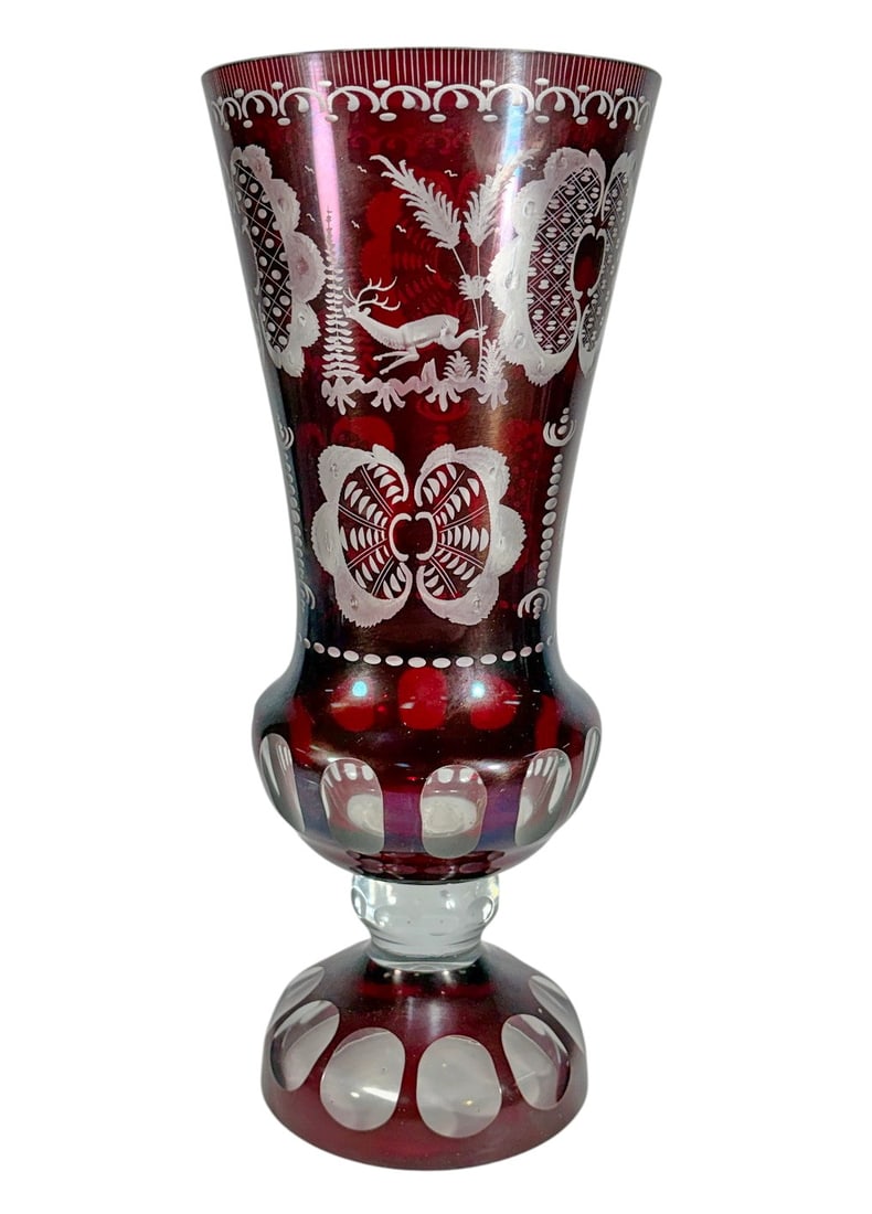 Large Bohemian Ruby Cut-to-Clear Floral Glass Vase: Tall Bohemian style ruby red glass vase featuring clear cut-to-color decoration throughout. The elongated body is decorated with etched floral and foliate motifs, geometric panels, and clear polished 