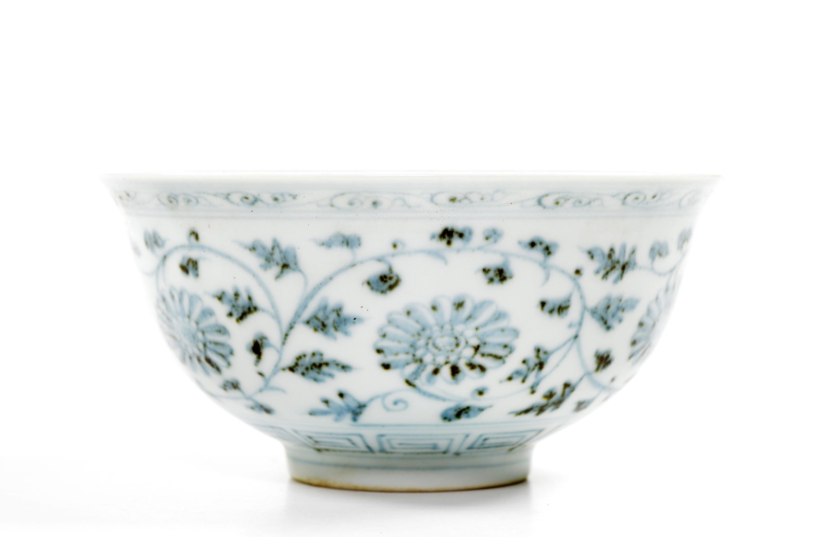 A Chinese Blue and White Porcelain Bowl: Very elegantly potted bowl decorated with chrysanthemum foliate scrolls inside and outside, wear, Ming dynasty. Provenance: Important private collection, Dallas, Texas. Diameter: 6 inches
