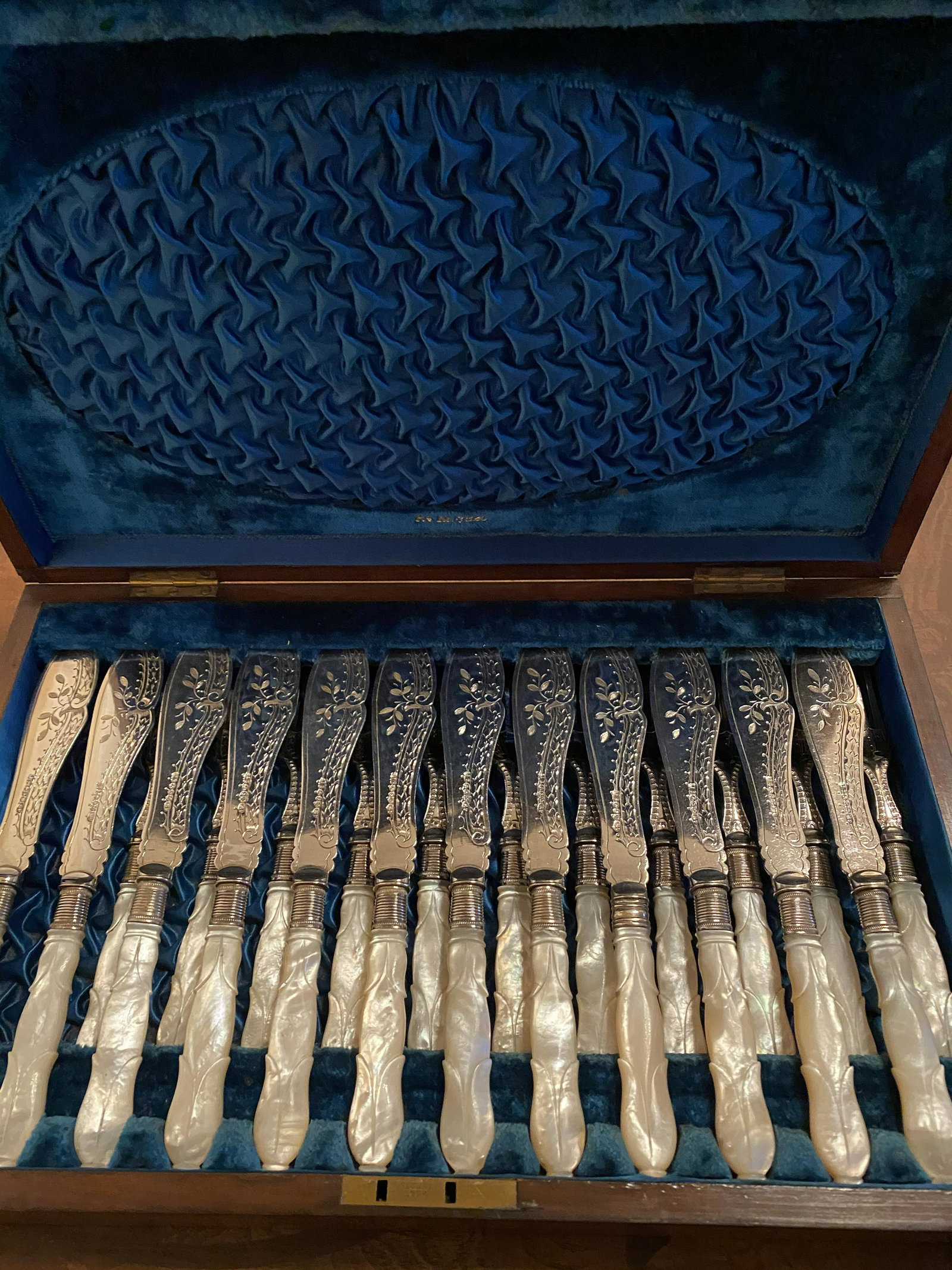 A Case of Dining Set: 19th century. Mahogany case with mother of pearl settings.