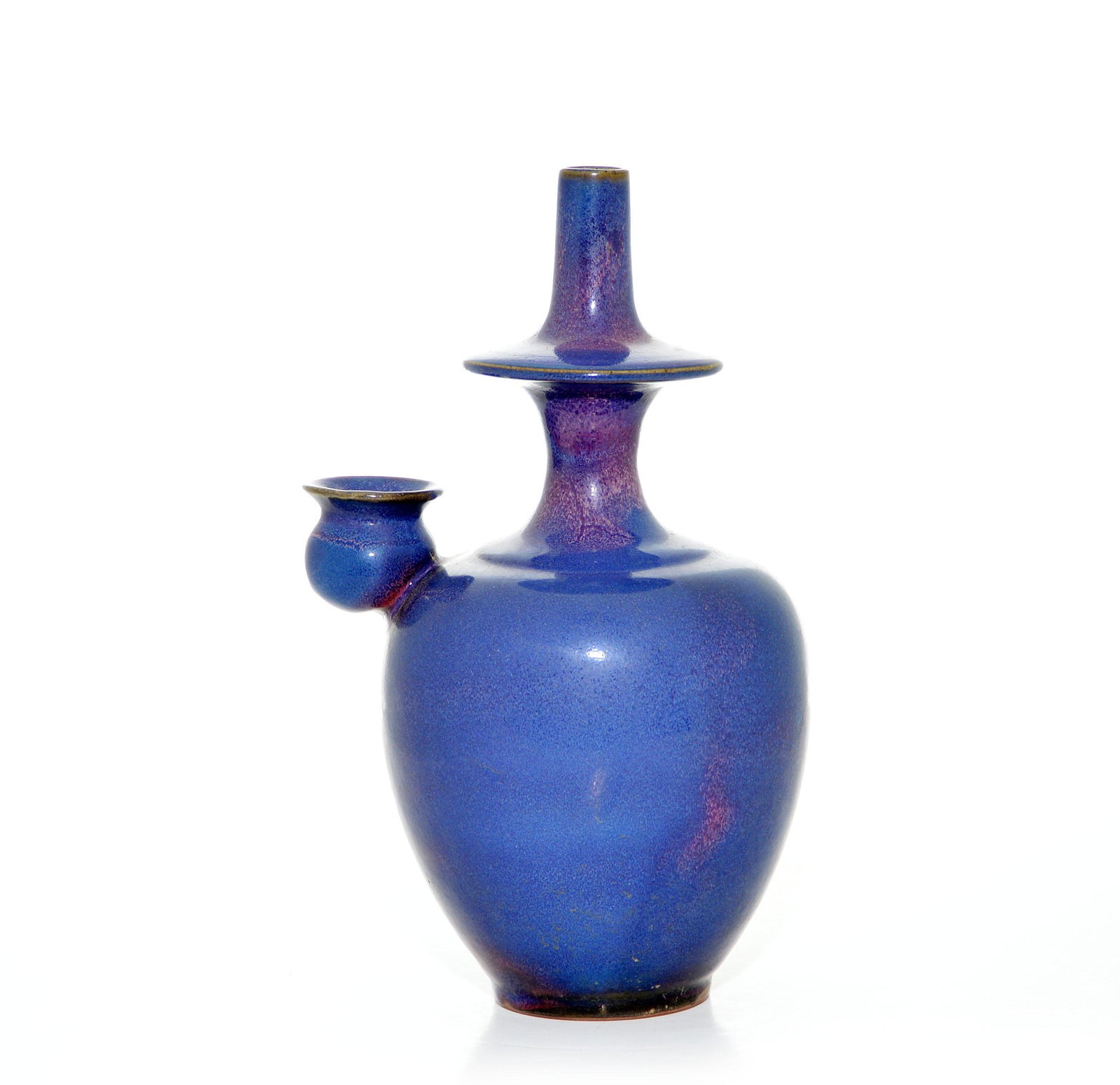 Very Rare Sino-Tibetan Flambe-Glaze Penpa Vase: The globular body raised on a short foot and rising to a stepped neck and a thick disc-shaped neck supporting a trumpet mouth with a narrow opening, with an applied curved spout, the body exquisitely 