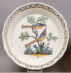Enamel Plate: Plate with a contoured rim and polychrome decoration in the center of two birds perched on the branches of a tree, one holding an insect in its beak, blue, manganese and ochre lines on the wing. 18th